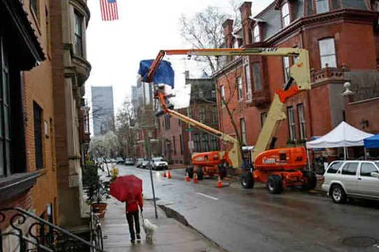 Crews taped Monday outside a mansion at 21st and Delancey. The block has been in such films as "The Sixth Sense" and "Trading Places." This shoot, including locations in Bensalem and at City Hall, has provided about 100 local jobs. (Michael S. Wirtz / Staff Photographer)