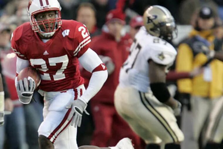Cornerback Jack Ikegwuonu hopes to be healthy for camp this year. In this file photo, Ikegwuonu returns a 62-yard interception for a touchdown against Purdue while playing for Wisconsin in 2005. (AP Photo / Andy Manis)