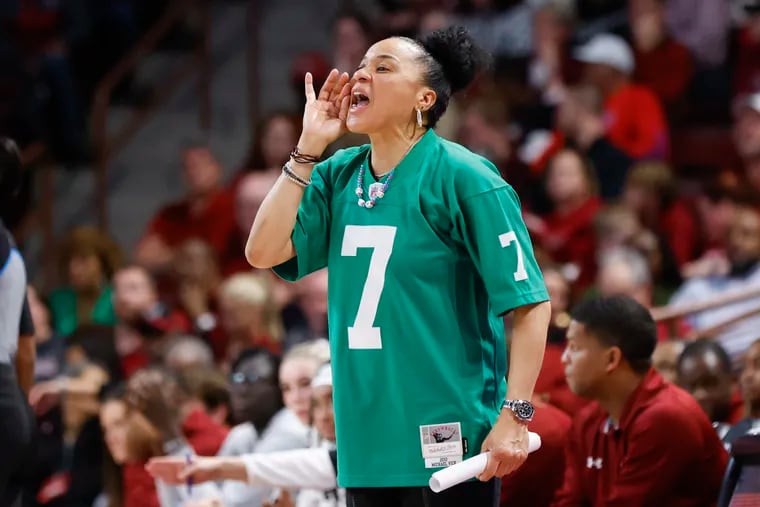 South Carolina head coach Dawn Staley, wearing Eagles green, directs her team against Kentucky during an NCAA college basketball game in Columbia, S.C., in January.