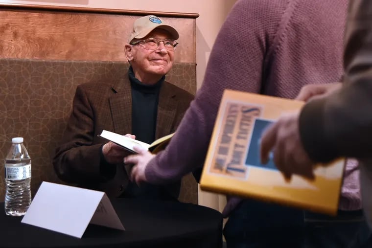 World-renowned fly fisherman Joe Humphreys signs copies of one of his books during a meet-and-greet before the screening of a new documentary by Lucas and Meigan Bell called “Live the Stream: The Story of Joe Humphreys.”