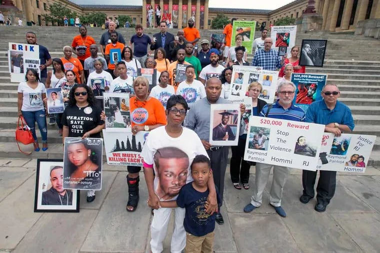 Philadelphians who have been impacted by gun violence gather on the steps of the Art Museum on June 22, 2016. Dorothy Johnson-Speight, who founded Mothers in Charge, is center with her grandson Khaaliq Roberts, who is named after her late son.