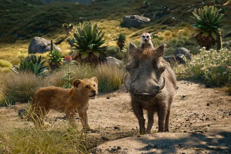 FILE - This file image released by Disney shows, from left, young Simba, voiced by JD McCrary, Timon, voiced by Billy Eichner, and Pumbaa, voiced by Seth Rogen, in a scene from "The Lion King." The Walt Disney Co. is ruling the box office again with the record-breaking debut of “The Lion King” this weekend. The studio says Sunday, July 21, 2019 that the photorealistic remake devoured an estimated $185 million in ticket sales from 4,725 North American locations. It’s a record for the month of July, PG-rated films and the ninth highest opening of all time.(Disney via AP, File)