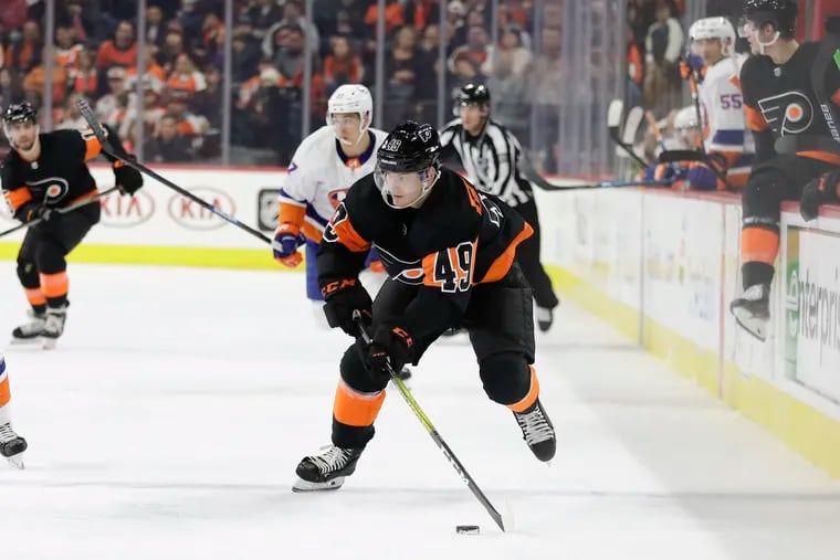 Flyers left winger Joel Farabee skates with the puck against the New York Islanders in an early-season game. The teams met in Game 1 of the conference semifinals Monday in Toronto.