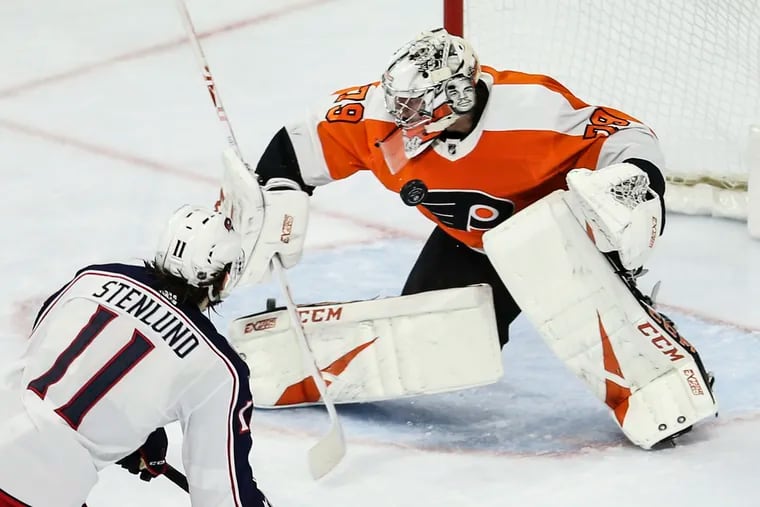 Flyers' goalie Carter Hart stops the shot of Blue Jackets' Kevin Stenlund during the third period at the Wells Fargo Center in Philadelphia, Tuesday,  February 18, 2020.  Flyers beat the Blue Jackets 5-1.