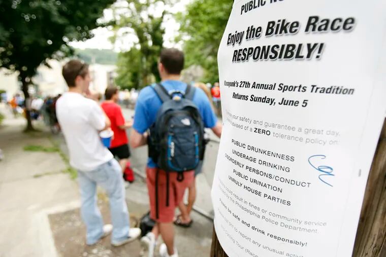 A sign posted on a pole along "the wall" in Manayunk warns fans about zero tolerance during the TD Bank International Championship bike race in Philadelphia, Pa., on  June 5, 2011. ( David Maialetti / staff photographer )