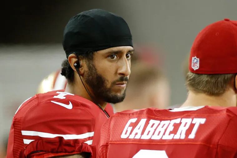 San Francisco 49ers quarterbacks Colin Kaepernick, left, and Blaine Gabbert stand on the sideline during the second half of an NFL preseason football game against the Green Bay Packers on Friday, Aug. 26, 2016, in Santa Clara, Calif. Green Bay won 21-10.
