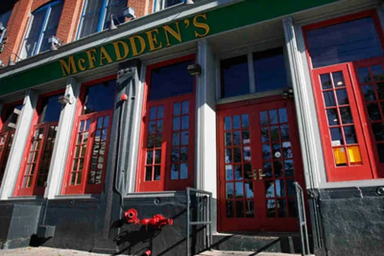 A settlement has been reached between the owners of McFadden's and a black bartender who filed a lawsuit against the bar and its owner. (Alejandro A. Alvarez / Staff Photographer)