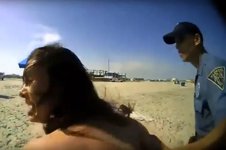 Screenshots from police body cam videos show arrest of woman at Wildwood beach.