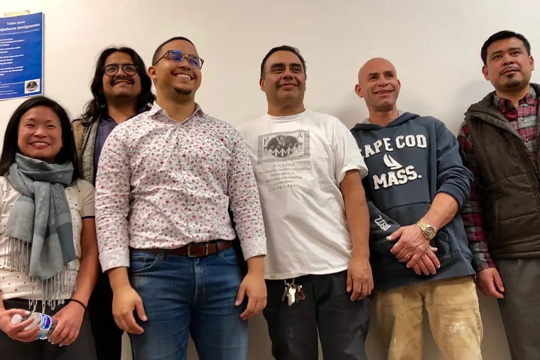 Attendees and trainers at the third session of the Immigrant Workers Academy organized by the City of Philadelphia in Kensington on Friday. Symbol Lai, the city official who founded the academy, is at far left.