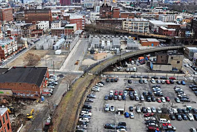 With little fanfare, a new, green use for one of Phila's old industrial landmarks is taking shape, the old Reading Viaduct.  Focusing on the SEPTA spur which starts just off Noble Street (lower left) and veers off to 11th Street where it connects to the Reading Viaduct.  This overall photo was taken from 401 N. Broad St. April 3, 2014.  ( CLEM MURRAY / Staff Photographer )