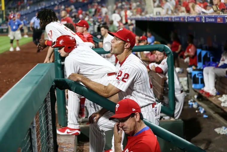 Gabe Kapler waits for officials to review the final play of the game, in which pinch runner Vince Velasquez left the bag too early on a fly out and got called out to end the ninth inning.
