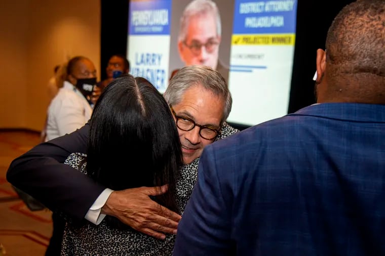 District Attorney Larry Krasner embraces City Councilmember Helen Gym as he arrives to make his victory speech on Tuesday.