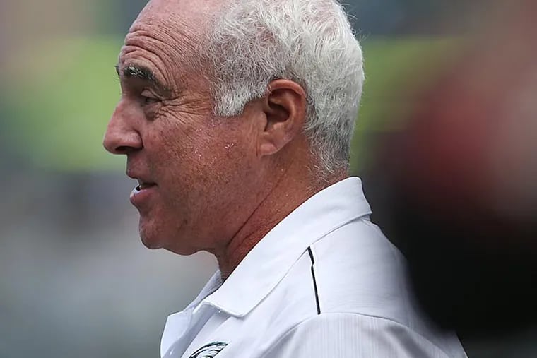 Eagles owner Jeffrey Lurie, right, talks with Jon Dorenbos, left,
during Philadelphia Eagles Training Camp at the Lincoln Financial
Field in Philadelphia on July 28, 2014. DAVID MAIALETT / Staff
Photographer
