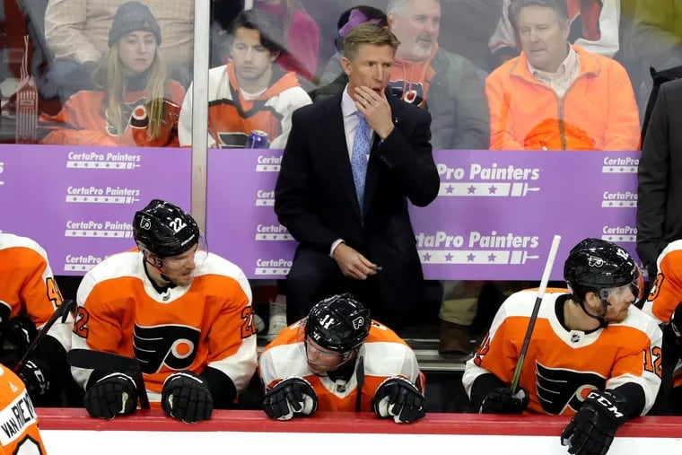 Dave Hakstol and a few of the Philadelphia Flyers at a previous game. (Charles Fox/Philadelphia Inquirer/TNS)