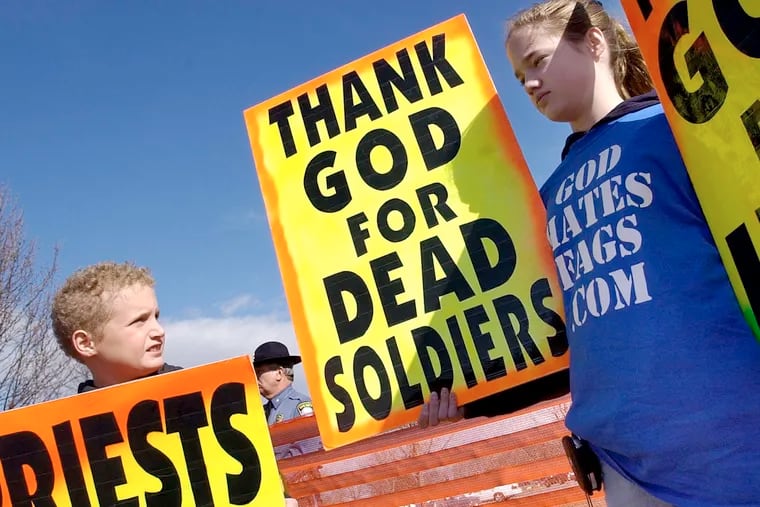 2006Grace Phelps-Roper , then 13, with her brother Gabriel, then 10, at a Westboro Baptist protest. DYLAN SLAGLE