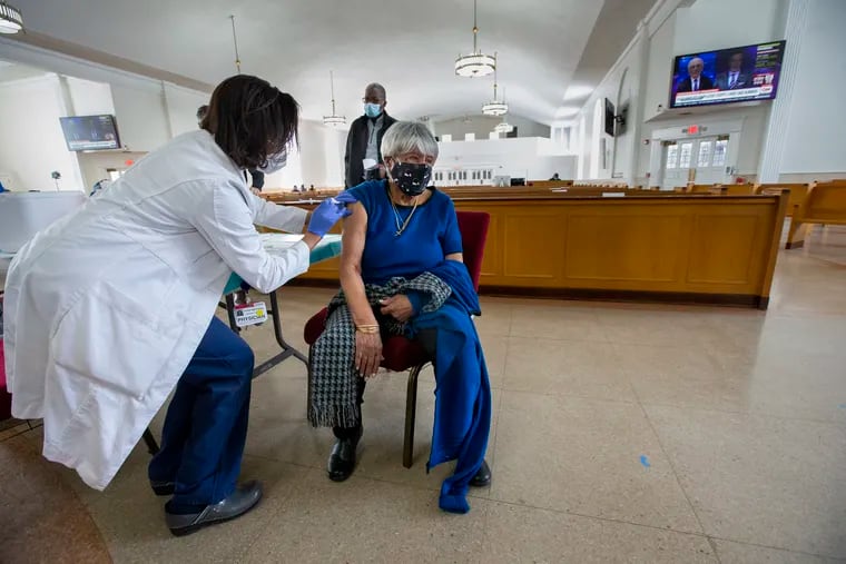 101-year-old Edna Wooden gets her COVID-19 vaccine from Dr. Kisha Martin, Chair of Emergency at Holy Redeemer Hospital. Black church leaders and parishioners were being vaccinated in the sanctuary of Salem Baptist Church on Tuesday.