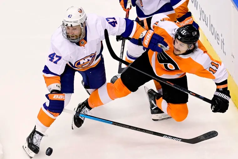 Travis Konecny (11), shown here being pushed off the puck by New York's Leo Komarov, had a strong game Monday, but still has not scored a goal in the postseason. He only has one goal, in fact, in 16 career playoff games.