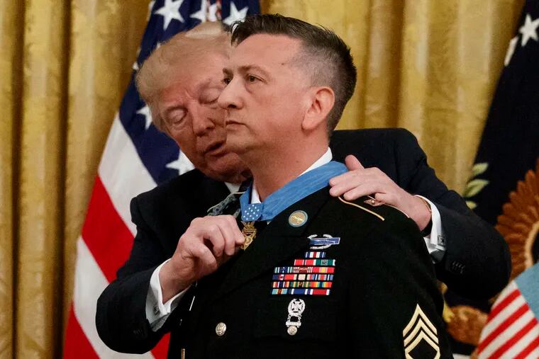 President Donald Trump awards the Medal of Honor to Army Staff Sgt. David Bellavia in the East Room of the White House in Washington, Tuesday, June 25, 2019, for conspicuous gallantry while serving in support of Operation Phantom Fury in Fallujah, Iraq.