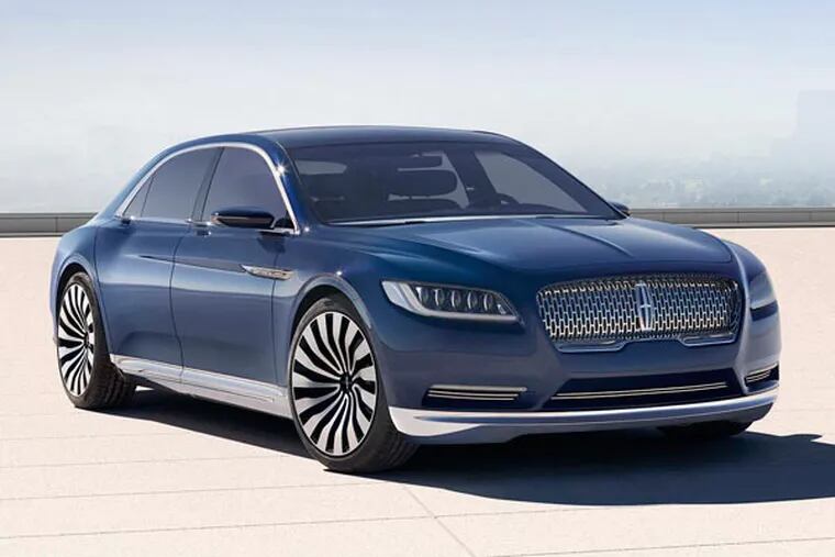 With a sleek silhouette and a new centered chrome grille, the Continental Concept signals the arrival of a new face for Lincoln. (Ford Motor Company)