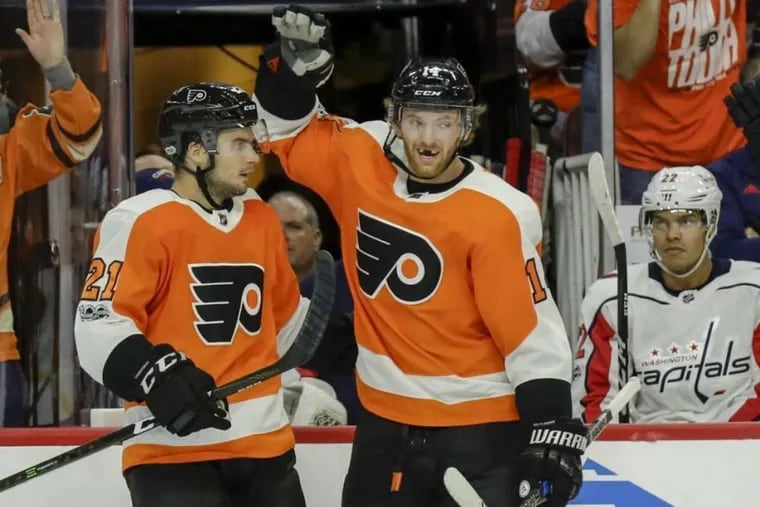 Speed boys: The Flyers’ Scott Laughton (right) celebrates his short-handed first-period goal with teammate Sean Couturier against the Capitals on Saturday.