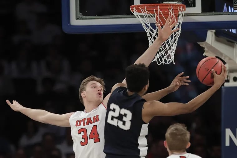 Penn State guard Josh Reaves (23) shoots next to Utah forward Jayce Johnson (34) in the first quarter of an NCAA college basketball game for the NIT championship Thursday, March 29, 2018, in New York. (AP Photo/Julie Jacobson)