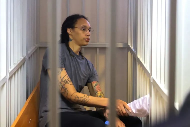 Brittney Griner sitting inside a defendants' cage after the court's verdict in Khimki, outside Moscow, on Aug. 4.
