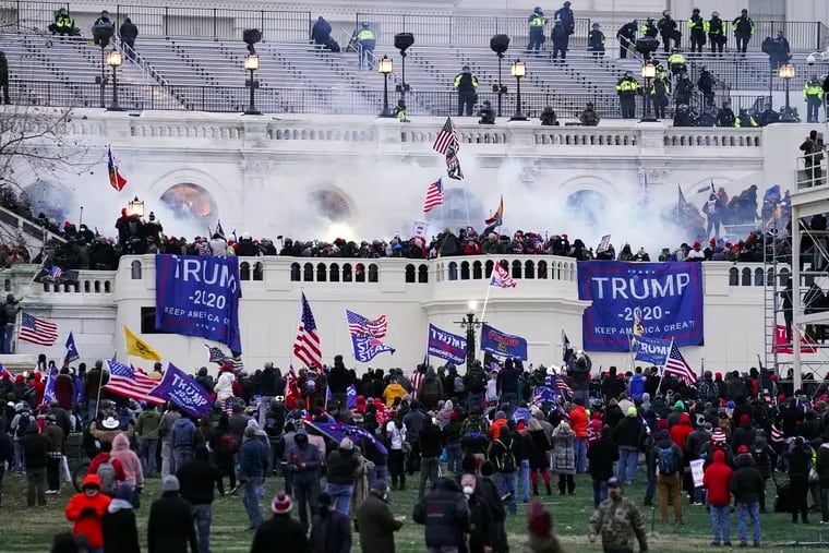 Violent insurrectionists, loyal to then-President Donald Trump, storming the Capitol in Washington on Jan. 6, 2021.