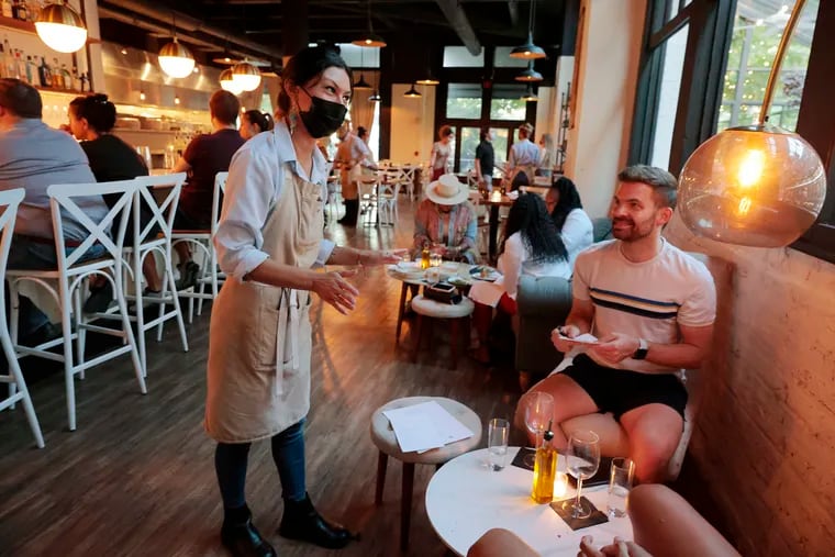 Restaurants and bars have been on the hook to enforce masking since June 2020, and this is the second time the city has dropped its mandate. Workers are skeptical — but hopeful — this time is different.