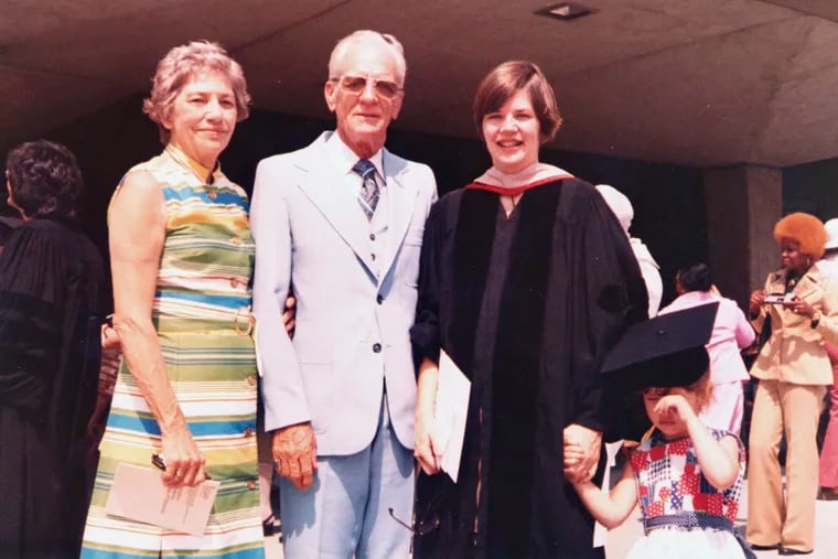  This 1976 photo provided by Sen. Elizabeth Warren's campaign shows her with her parents, Pauline and Donald Herring, and daughter, Amelia, at her Rutgers Law graduation in Newark N.J. (Elizabeth Warren campaign via AP)