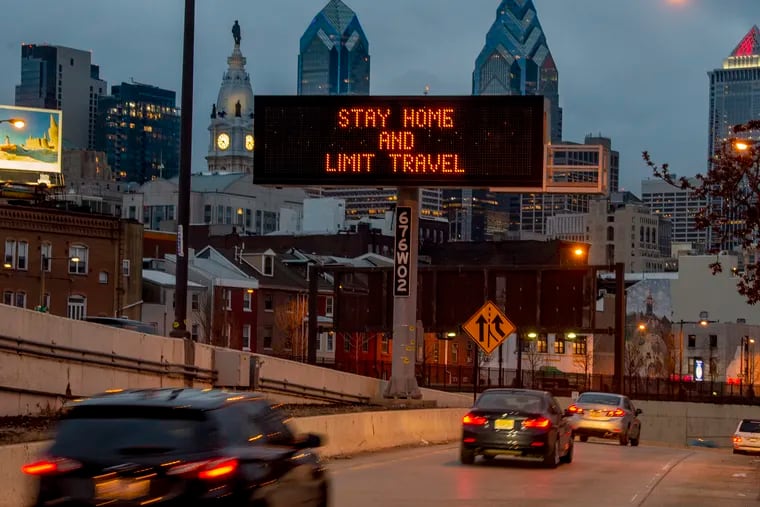A sign at the 8th Street ramp to westbound I-676 (Vine Street Expressway) Mar. 22, 2020 reflect Philadelphia's order that all residents stay in their homes except when engaging in life-sustaining activities beginning at 8 a.m. Monday because of the coronavirus crisis.