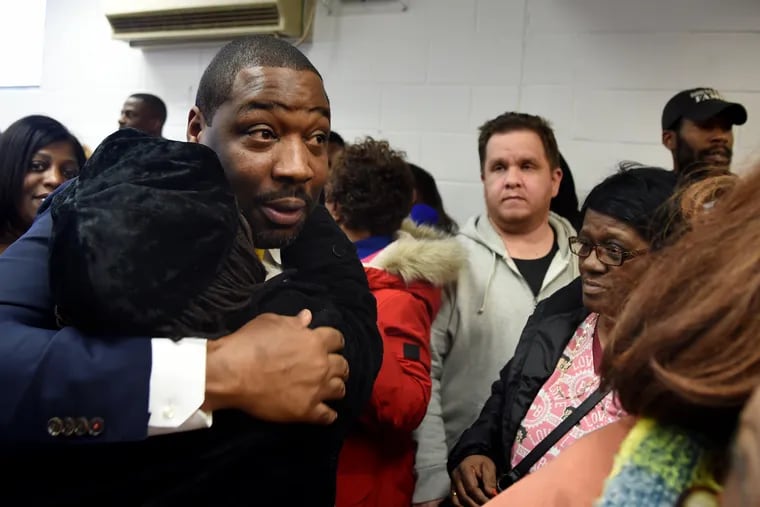 City Councilmember Kenyatta Johnson is greeted by supporters following a press conference and rally at Wharton Square Park in his district Wednesday. In a 21-count indictment, federal authorities accused Johnson of illegally exploiting his elected office to advance his wife's consulting career.