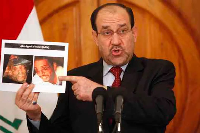Prime Minister Nouri al-Maliki shows photos of a man identified as Abu Ayyub al-Masri, one of the two slain al-Qaeda leaders.