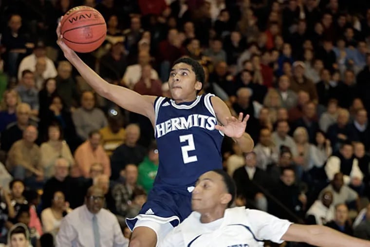 St. Augustine's # 2 Sa'eed Nelson is fouled by AC's # 24 Jamal
Williams in the 2nd quarter of the St.Augustine Prep at Atlantic City
H.S. boys basketball game on January 30, 2015.  (Elizabeth Robertson/Staff Photographer)