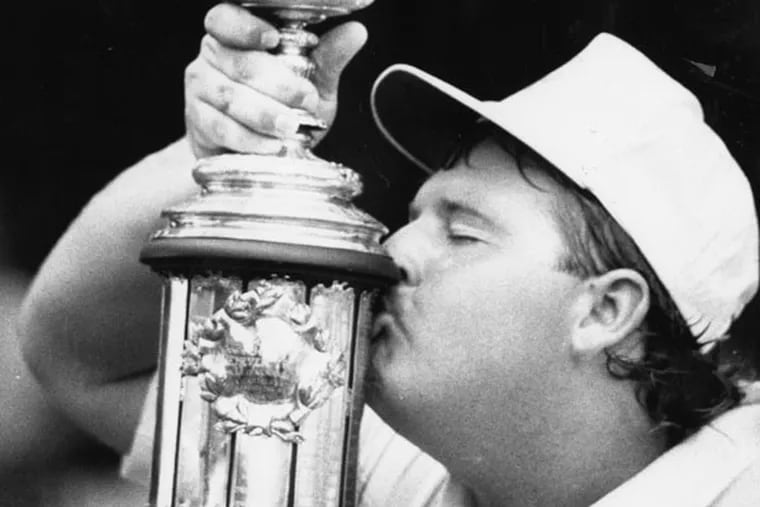 U.S. Amateur Championship at Merion Golf Club winner Chris Patton kisses his trophy.