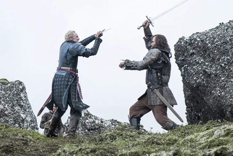 Brienne of Tarth and the Hound of “Game of Thrones” in a swordfight scene.
