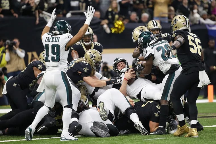 Nick Foles scores a touchdown in the first quarter against the Saints.