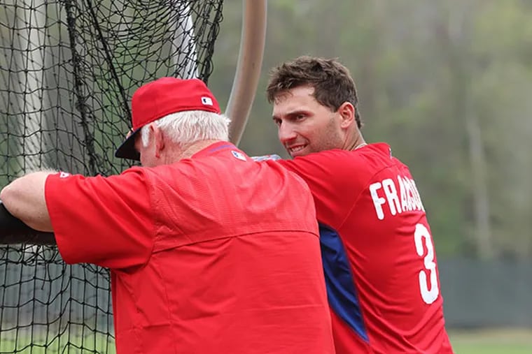 Guest instructor Charlie Manuel chats with Jeff Francoeur at Bright
House Field in Clearwater, Fla. (David Swanson/Staff Photographer)