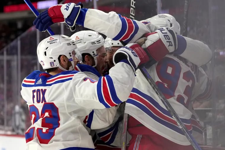 Chris Kreider #20 of the New York Rangers is congratulated by teammates after scoring a goal against the Carolina Hurricanes during the third period in Game Six of the Second Round of the 2024 Stanley Cup Playoffs at PNC Arena on May 16, 2024 in Raleigh, North Carolina.  (Photo by Grant Halverson/Getty Images)