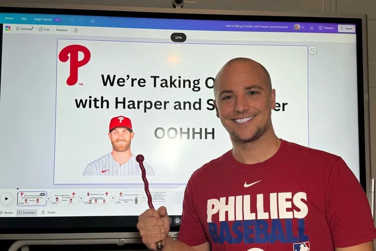Bethlehem schoolteacher Sean Connolly, 37, of Coopersburg, poses with the lyrics he wrote for a Phillies remix of "Dancing On My Own" for classrooms. The song has been viewed more than 800,000 times across Instagram and TikTok.