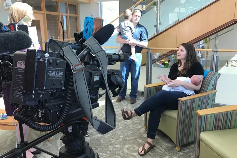 Emily Eekhoff talks to a TV station after her daughter Ruby was born. She said counting the fetal kicks led to a Caesarean section that saved Ruby's life. Husband Jeremy holds their son, Liam. Today, a nonprofit group, Count the Kicks, promotes the method.