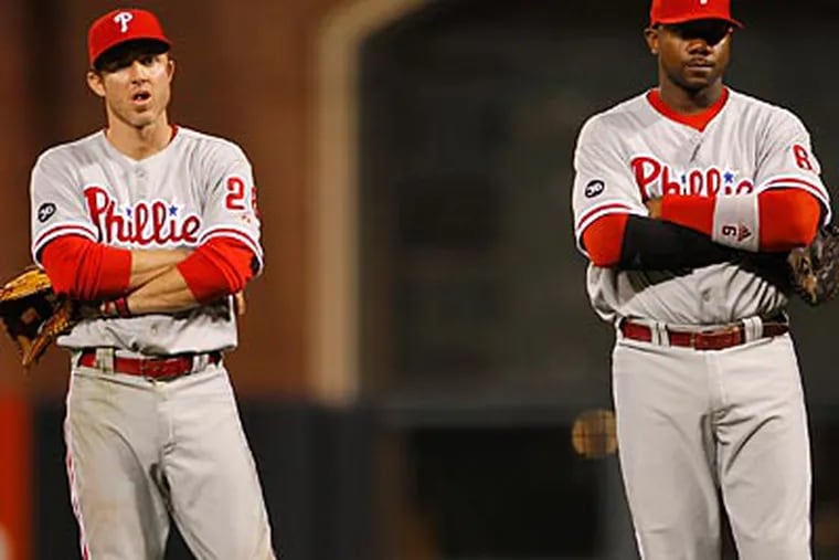 Chase Utley, Ryan Howard and the Phillies must win three straight games to take the NLCS. (Yong Kim / Staff Photographer)