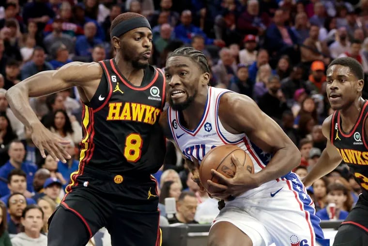 Sixers Shake Milton splitting Hawks defenders Justin Holiday and Aaron Holiday at the Wells Fargo Center in Philadelphia on Nov. 12.