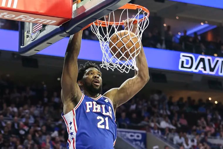 Sixers' Joel Embiid dunks against the Nets during the 3rd  quarter of Game 5 of the first round of the NBA playoffs at the Wells Fargo Center in Philadelphia, Tuesday, April 23, 2019.  Sixers beat the Nets 122-100 to win the first round of the playoffs (4-1).