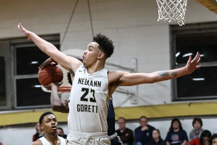 Neumann Goretti's Jordan Hall (23) did a little bit of everything in the Saints' 71-46 win over Cardinal O'Hara in the quarerfinals of the Philadelphia Catholic League playoffs.