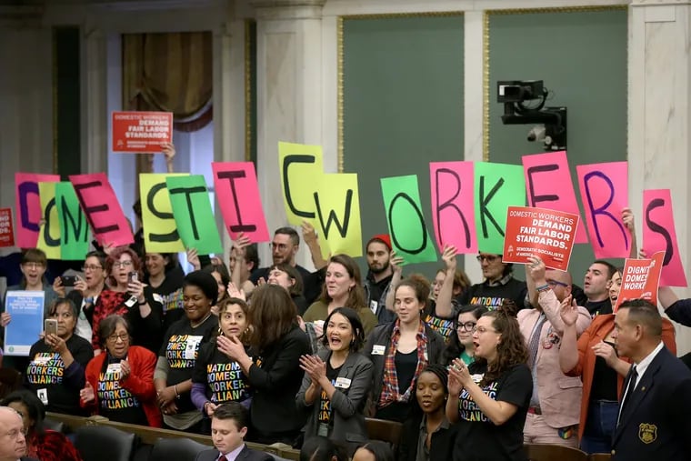 Supporters cheer after City Council passed a bill expanding labor protections for domestic worker during a meeting at City Hall in Philadelphia on Thursday, Oct. 31, 2019. The bill was sponsored by Councilwoman Maria Quiñones-Sánchez.