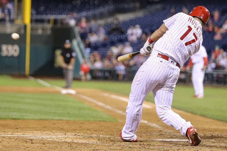 Rhys Hoskins hits a three-run double in the seventh inning.