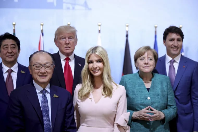 Japanese Prime Minister Shinzo Abe (from left), World Bank Group president Jim Yong Kim,  President Trump, his daughter Ivanka, German chancellor Angela Merkel and Canada’s Prime Minister Justin Trudeau, pose at a panel discussion during the G-20 summit in Hamburg, Germany on Saturday.