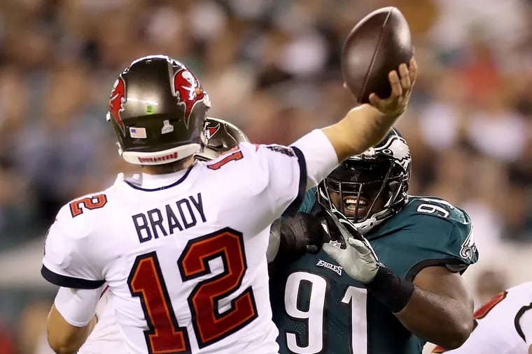 Fletcher Cox pressures Tampa Bay quarterback Tom Brady during their game in October.