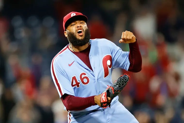 Phillies pitcher Jose Alvarado celebrates after getting the final out of the game to beat the Braves.