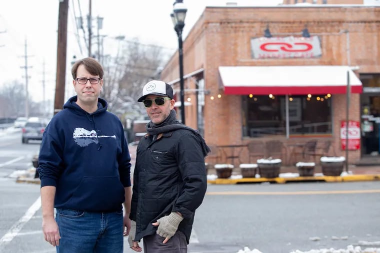 Aaron Clark (left), owner of Smoke BBQ in Haddon Heights, and Joe Gentile (right), owner of Local Links stand for a portrait outside Local Links in Haddon Heights. Tickets for the Taco Crawl will include their restaurants this weekend.